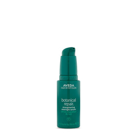 Aveda Botanical Repair overnight serum bottle close-up showing sleek packaging and luxury feel.
