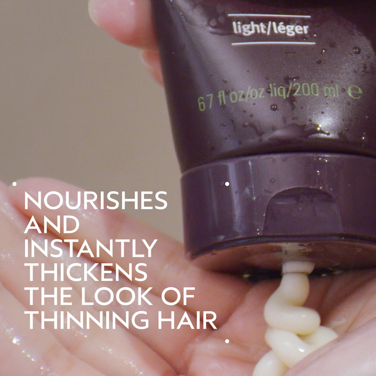 Close-up of Aveda Invati Ultra Advanced Thickening Conditioner Light label and benefits