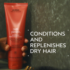 Close up of the Aveda Nutriplenish Deep Moisture conditioner cap on the bottle.