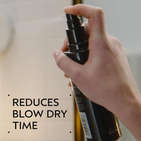 Aveda Speed of Light spray applying evenly to hair during prep