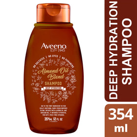Packaging on bathroom shelf featuring Aveeno Almond Oil Blend Shampoo