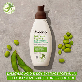 Aveeno Clear Complexion foaming bottle pour demonstrates a light, refreshing cleanse.