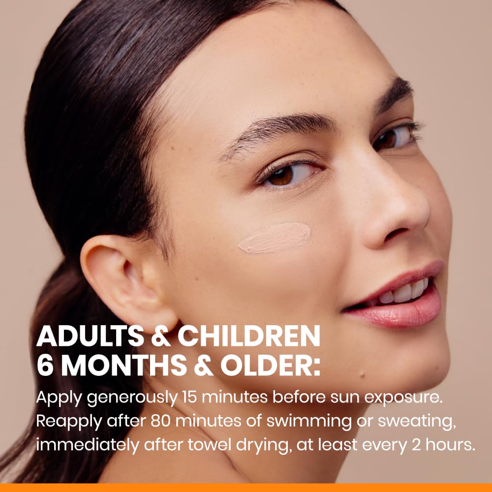 Applying sunscreen demonstrates smooth spread without white cast.