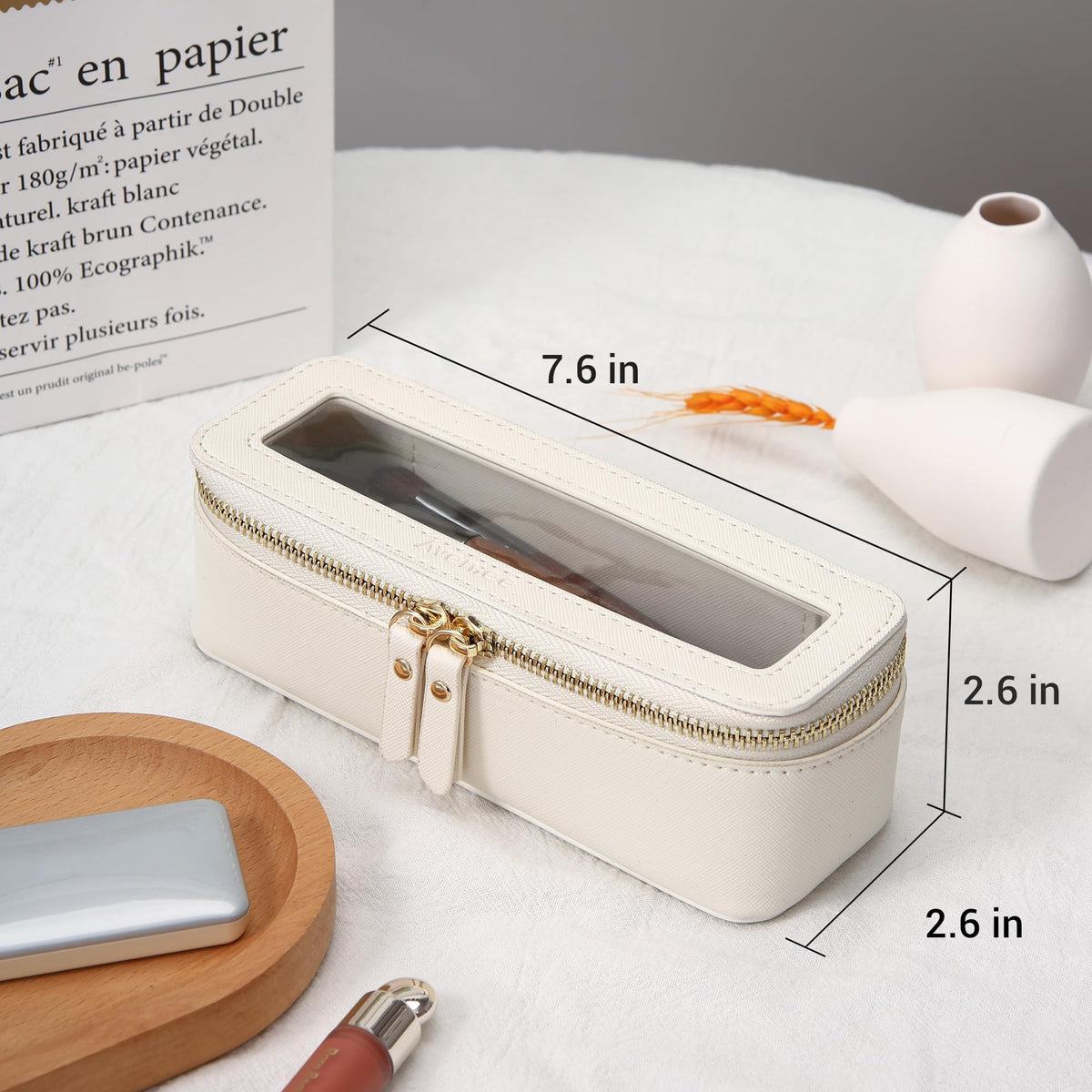 Aveniee water-resistant clear bag protects contents during rain or spills.