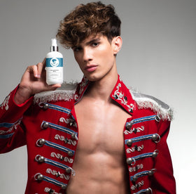 Hands applying Avenue Man Curl Activating Spray to damp hair for definition