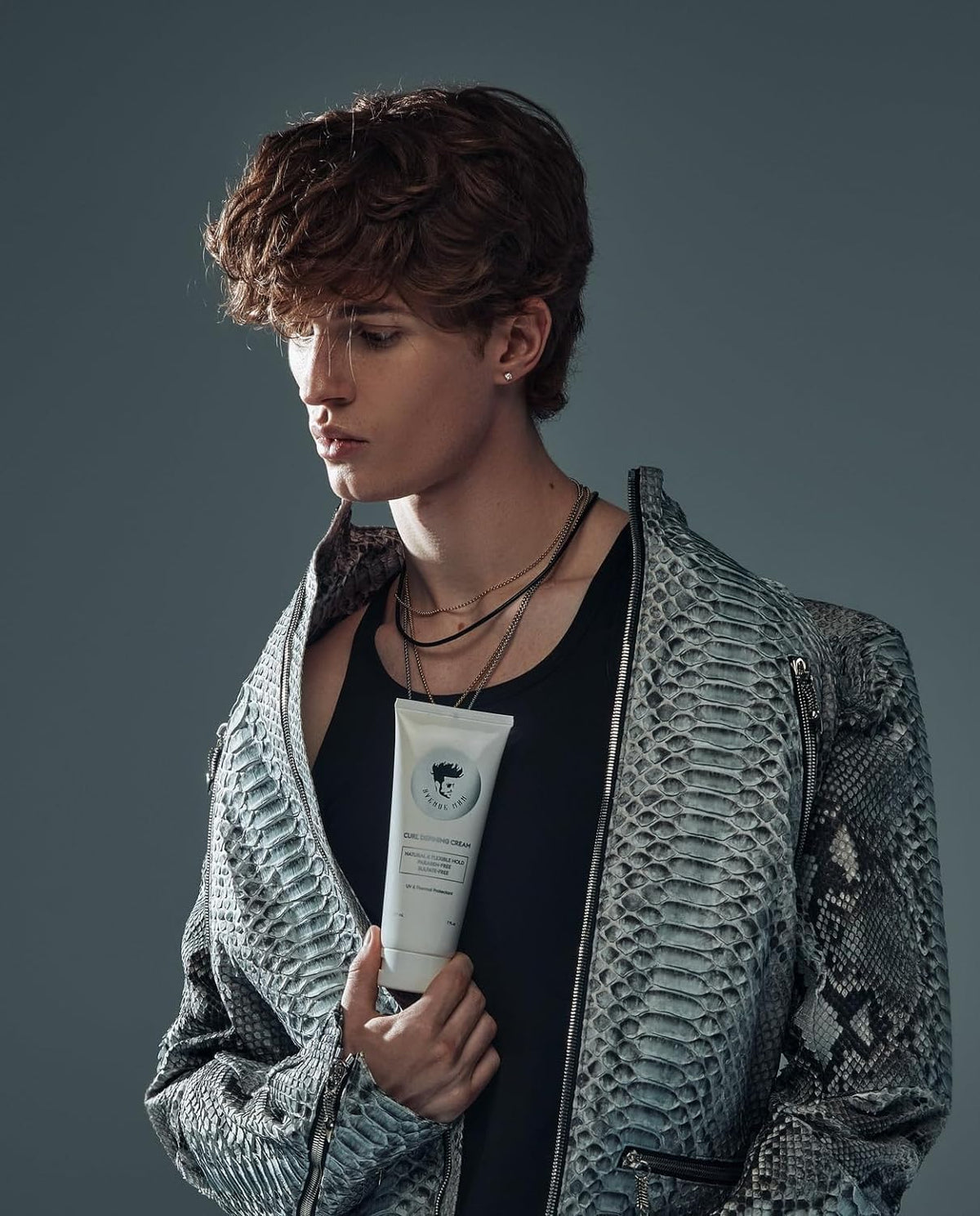 Defined curls with flexible hold using Avenue Man cream.