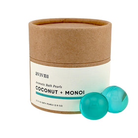Avivni bath oil beads close-up, showing pearl capsules for skin-softening hydration.