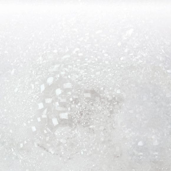 AVON Bubble Bath bottle closeup highlights chamomile and freesia scent and skin-friendly formula