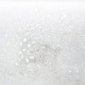 AVON Bubble Bath bottle closeup highlights chamomile and freesia scent and skin-friendly formula