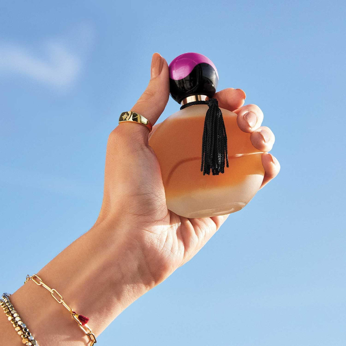 AVON Far Away perfume spray application, ideal for evenings and social events.