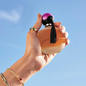 AVON Far Away perfume spray application, ideal for evenings and social events.
