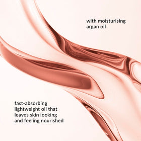 AVON Skin So Soft Argan Body Oil applied on skin for quick absorption.
