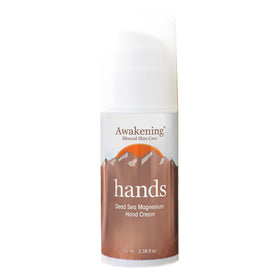 Awakening Hands magnesium-rich hand cream bottle on countertop for daily moisturizing
