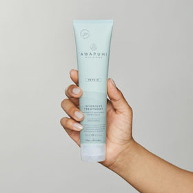 Creamy texture of Awapuhi Wild Ginger Intensive Treatment ready for application on hair.