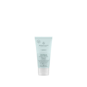 Awapuhi Wild Ginger Intensive Treatment bottle pouring with deep hydration for dry hair.