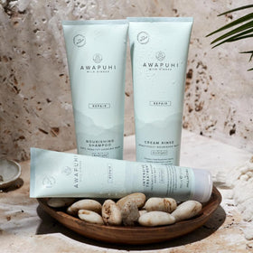 Packaging of Awapuhi Wild Ginger Intensive Treatment highlighting 25% PCR content.