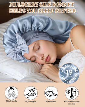 Adult wearing AWAYTR silk bonnet in haze blue, showcasing full hair protection.
