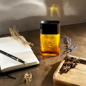 Azzaro Pour Homme on display, suggesting a refined signature scent.