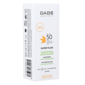 Babe Super Fluid Sunscreen being applied for a lightweight, matte look