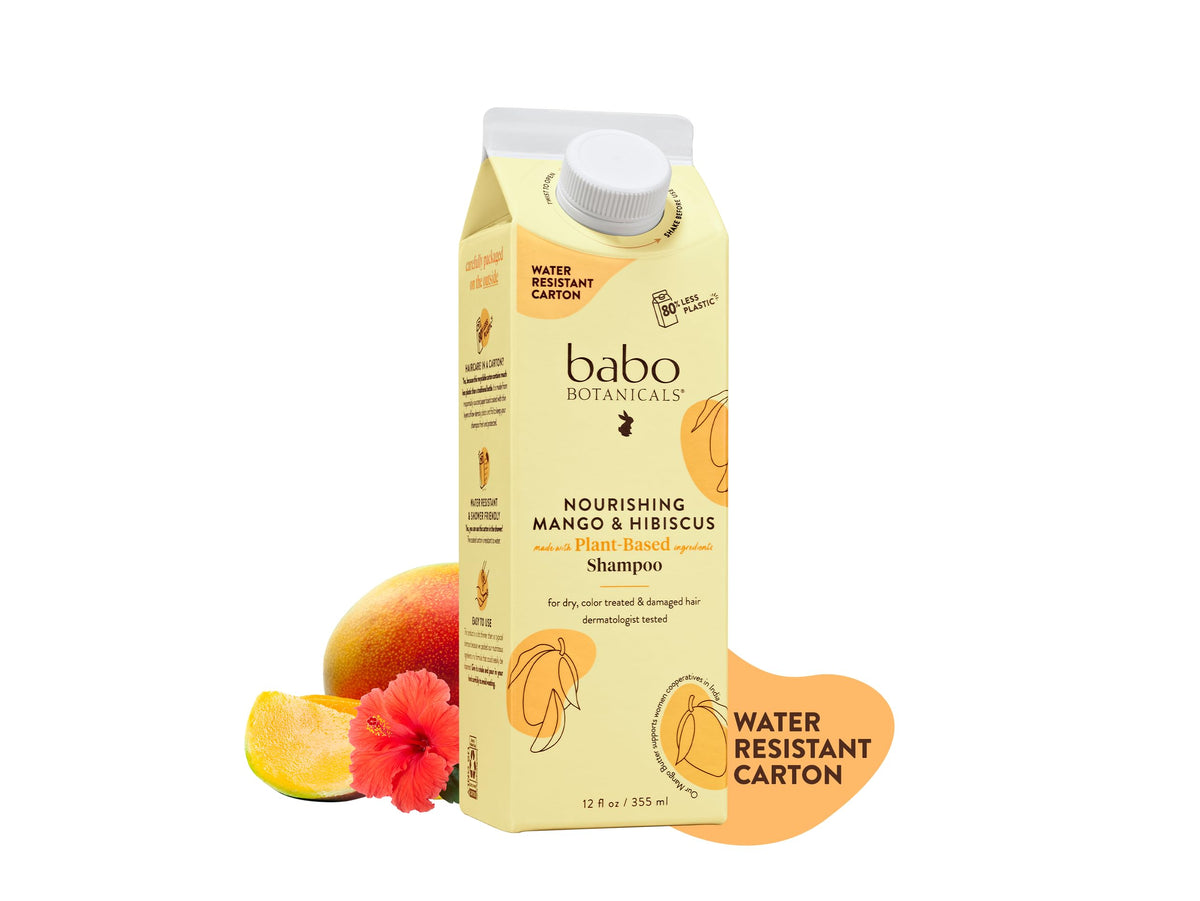Babo Botanicals Nourishing Mango & Hibiscus Shampoo bottle pouring for easy application and hydration.