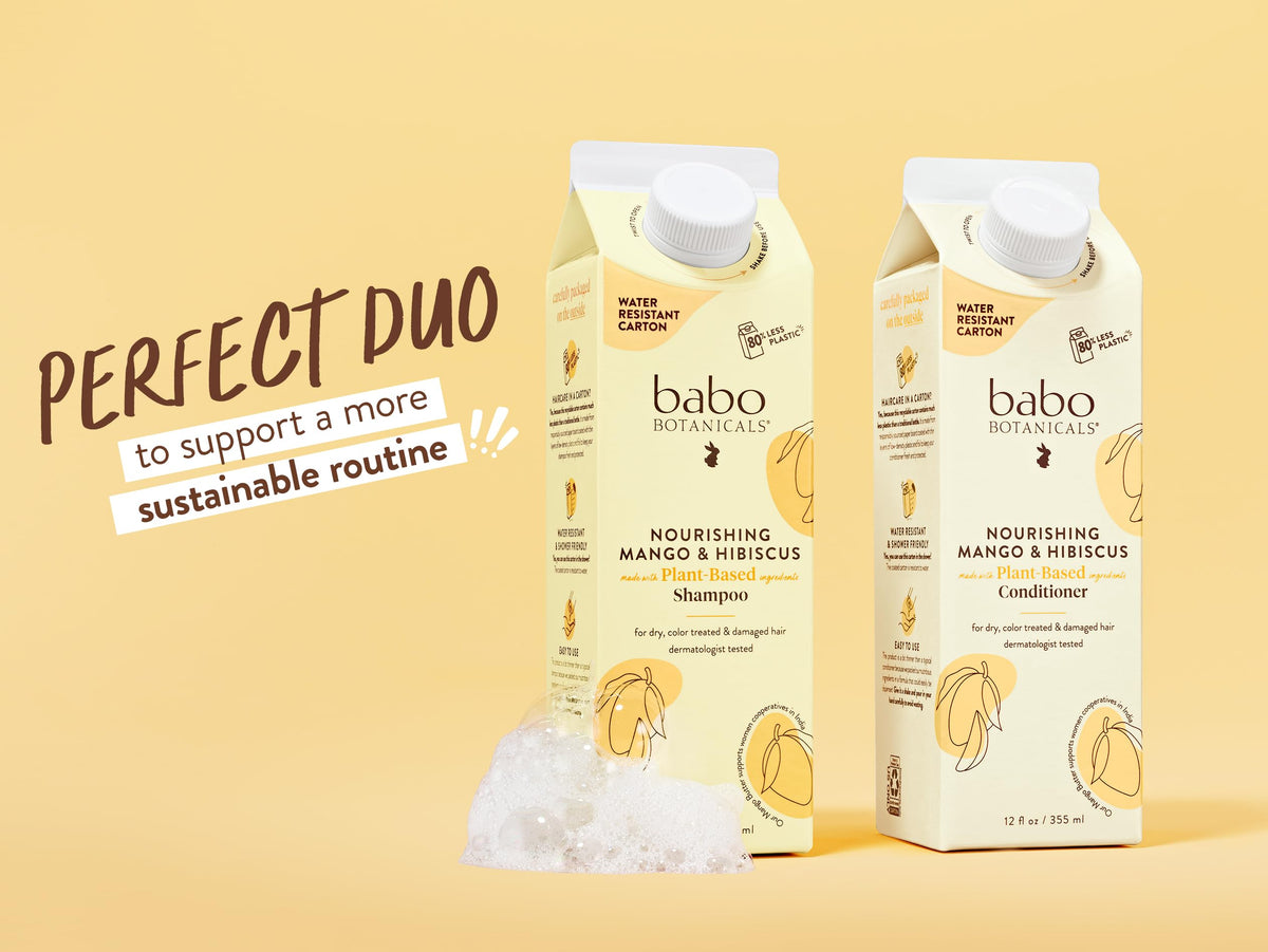 Babo Botanicals bottle in use during rinse to reveal smooth, hydrated strands.