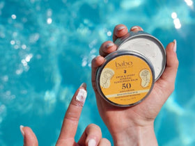 Babo Botanicals Swim & Sport Balm SPF50—face application close-up for athletic sun protection.