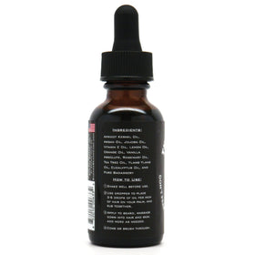 Applying Badass Beard Care oil nourishes beard and skin for a healthy look.
