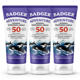 Badger biodegradable reef-safe sunscreen bottle on the beach for daily protection.