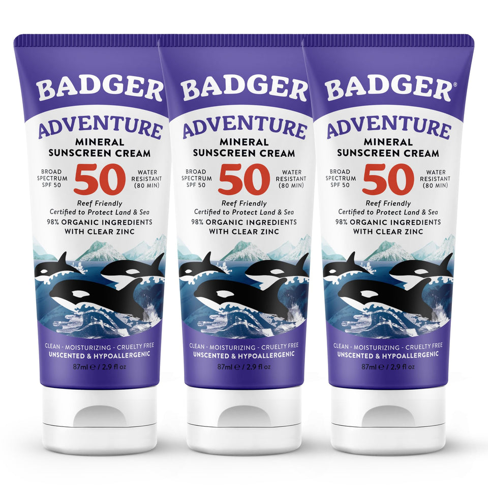 Badger biodegradable reef-safe sunscreen bottle on the beach for daily protection.