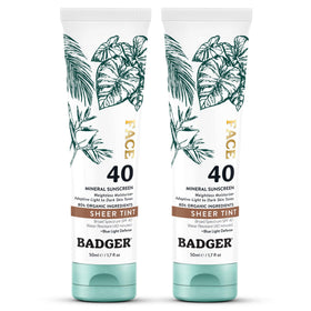 Badger tinted sunscreen bottle with SPF 40 and sheer warm tint for all skin tones.