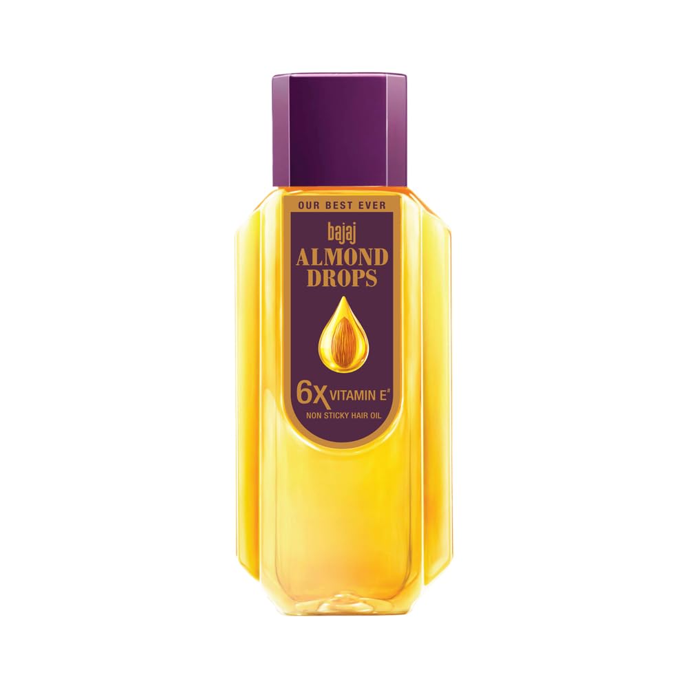 Bajaj Almond Drops oil bottle pours smoothly, nourishing hair with almond goodness.