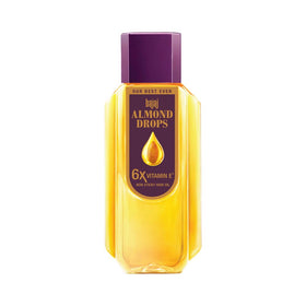Bajaj Almond Drops oil bottle pours smoothly, nourishing hair with almond goodness.