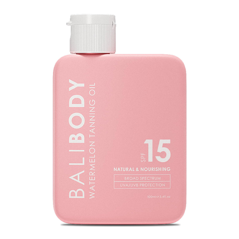 Bali Body Watermelon Tanning Oil bottle closeup highlighting hydrating formula for sun ready glow