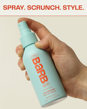 The Barb Shop Barb Sea Salt Spray hands-application shows easy, touchable waves with light hold.
