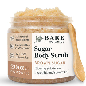 Bare Botanics Brown Sugar Scrub jar with wooden spoon showing creamy coconut-vanilla texture for smooth skin