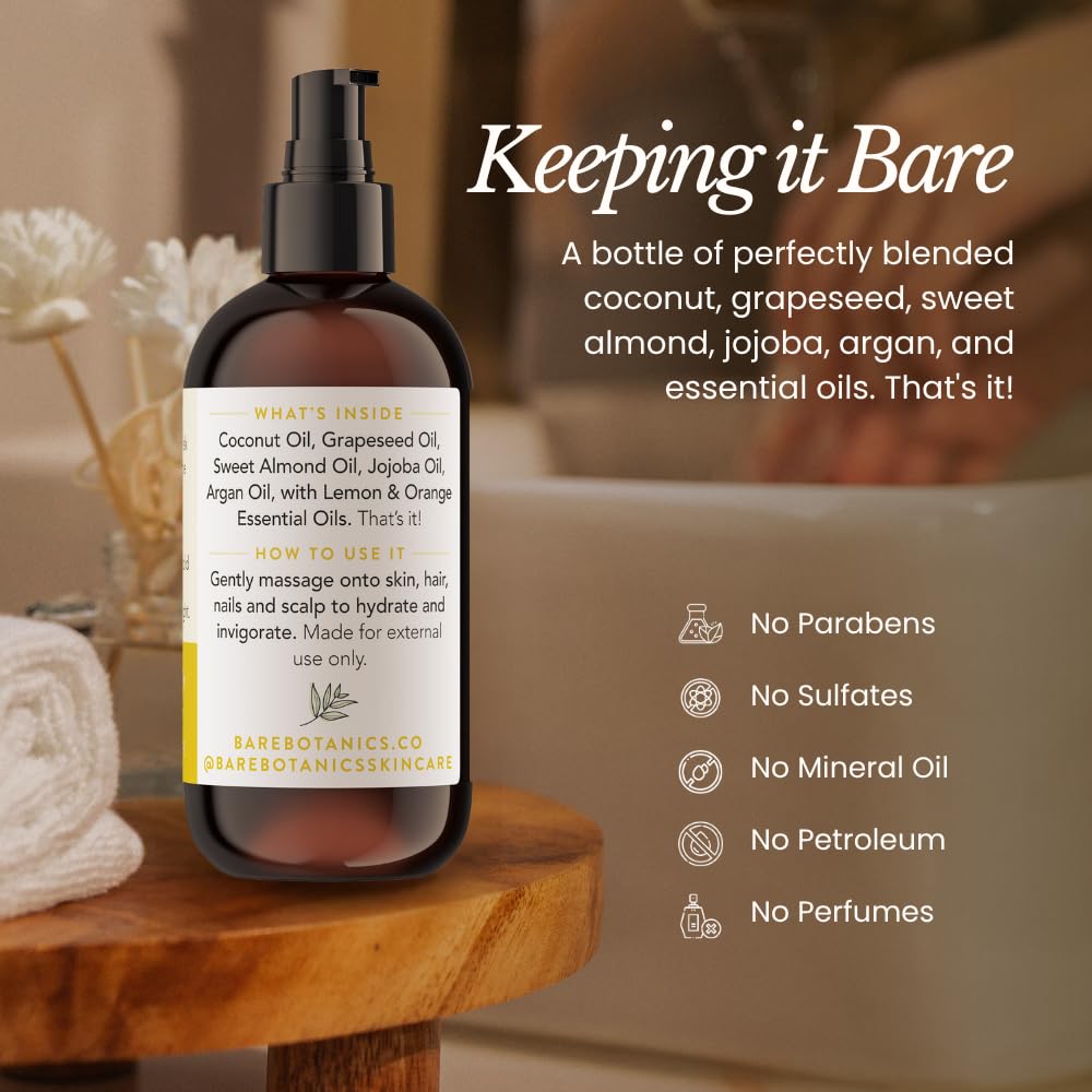 BARE BOTANICS Lemon Orange Body Oil being massaged into hands