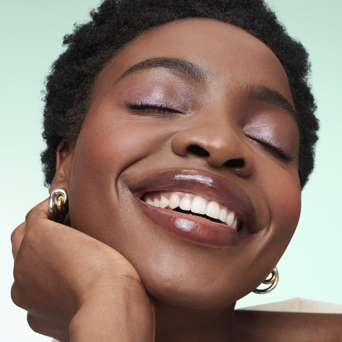 BareMinerals Mineralist Serenity Cranberry lip gloss-balm layered over lipstick for shine and dimension