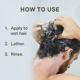 Barrel and Oak charcoal shampoo on bathroom shelf for daily use.