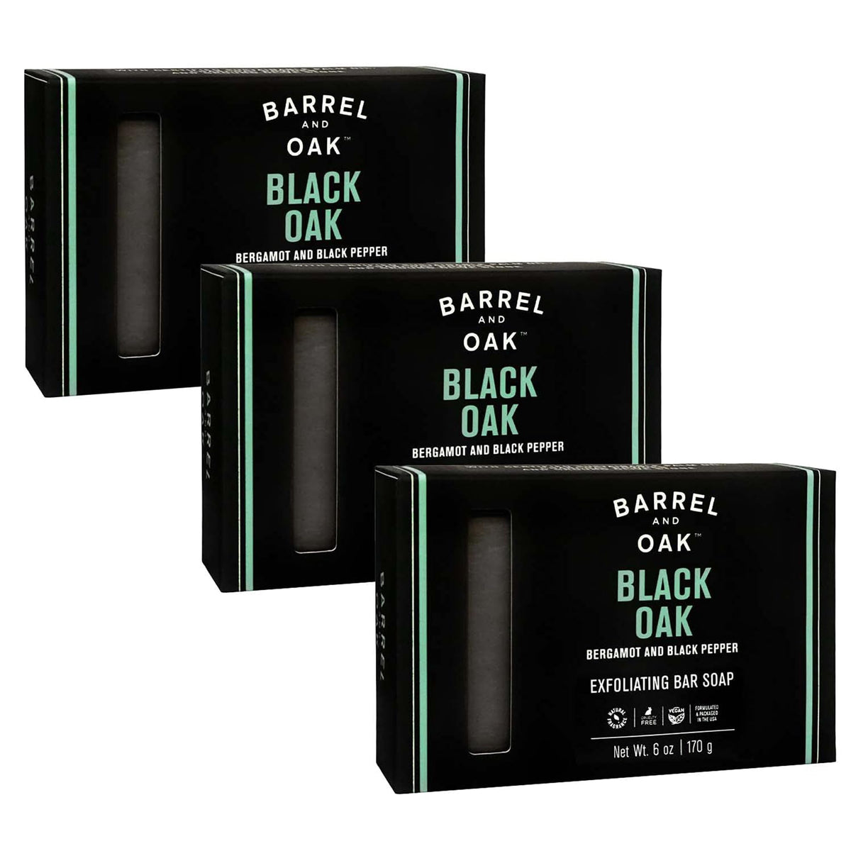 Barrel & Oak Black Oak exfoliating bar soap in hand for rugged cleansing.