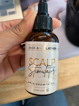 Bask and Lather mint rosemary oil bottle offers refreshing scalp care.