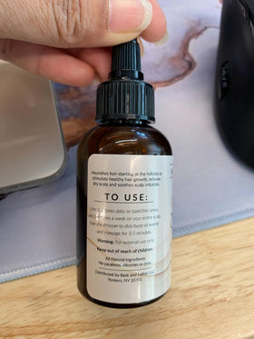 Bask and Lather scalp stimulator ready for use with massager.
