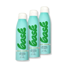 Bask SPF 30 mineral sunscreen spray bottle demonstrates easy, non-aerosol application.