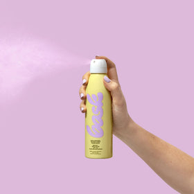Bask sunscreen spray with vanilla-coconut aroma for vacation vibes.
