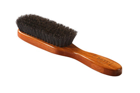Bass semi oval boar wood brush handle closeup highlights eco friendly bamboo and luxury finish.