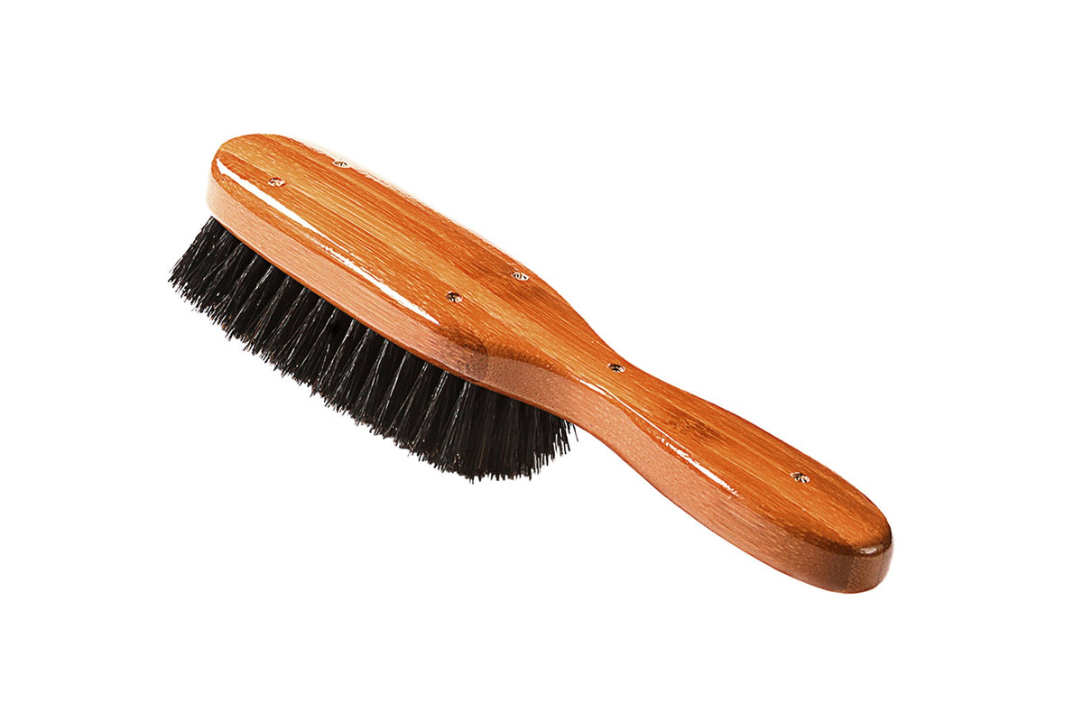 Bass semi oval boar wood brush professional use closeup signals salon level performance.