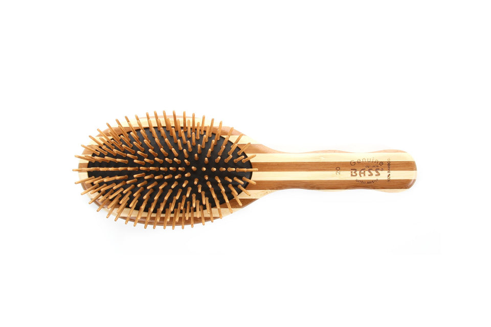 Bass The Green Brush bamboo pin close-up for gentle detangling and natural styling.
