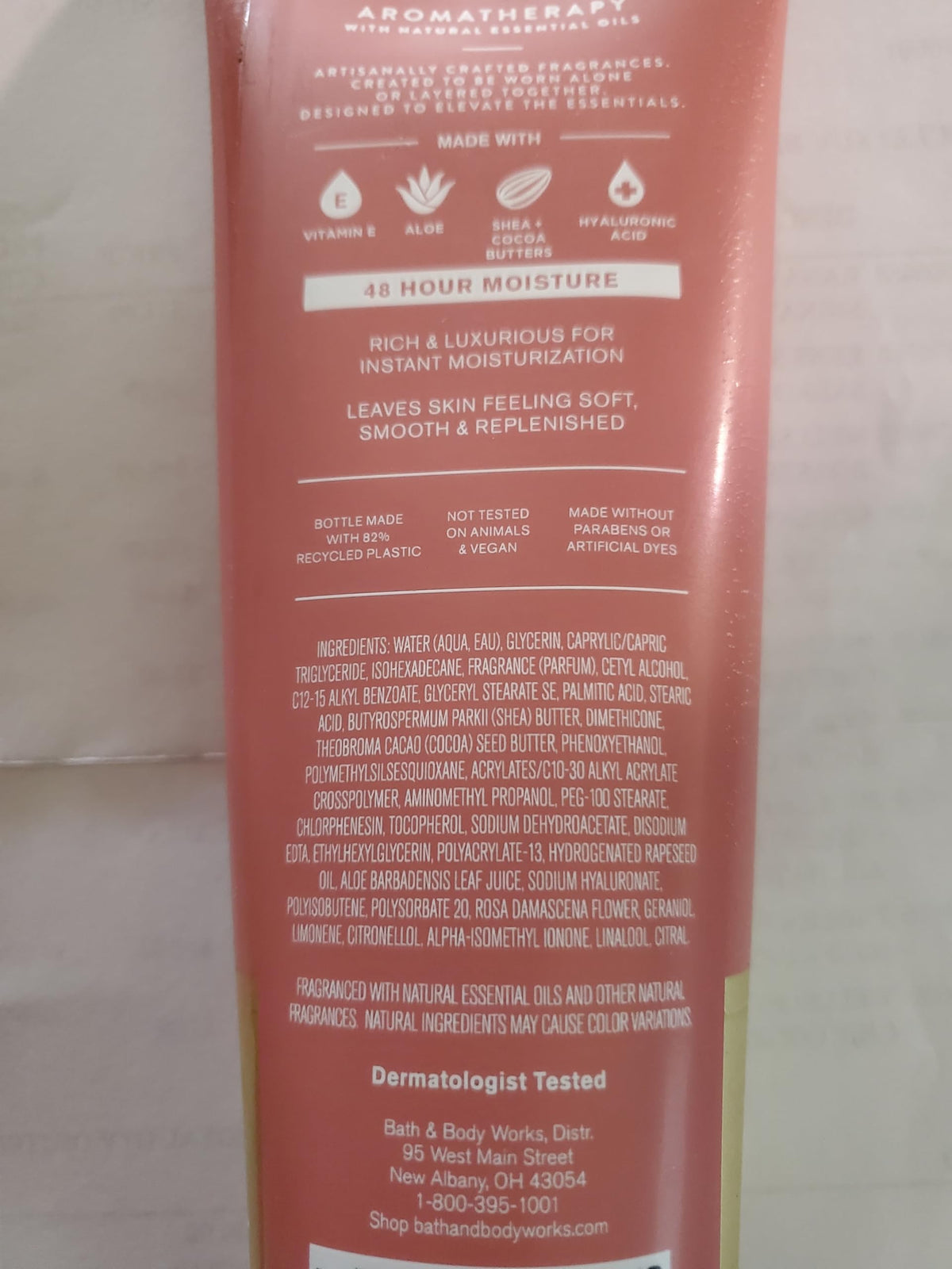Applying Bath & Body Works Heirloom Rose cream to forearm for hydration.