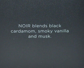 Lifestyle shot of Noir cologne in use for evenings and special occasions.