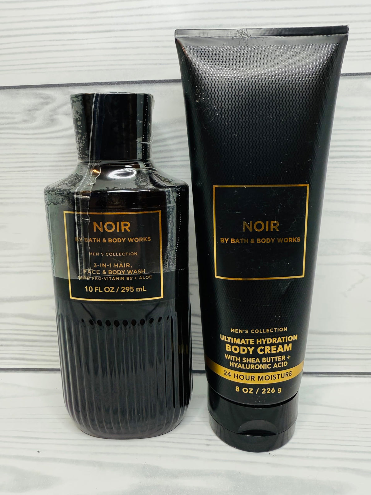 Noir Ultimate Hydration Body Wash bottle with pump offering refreshing cleansing and conditioning lather.