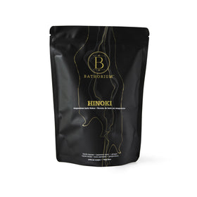 Bathorium Hinoki mineral bath flakes in a 26 oz bag for a relaxing, skin-friendly soak.
